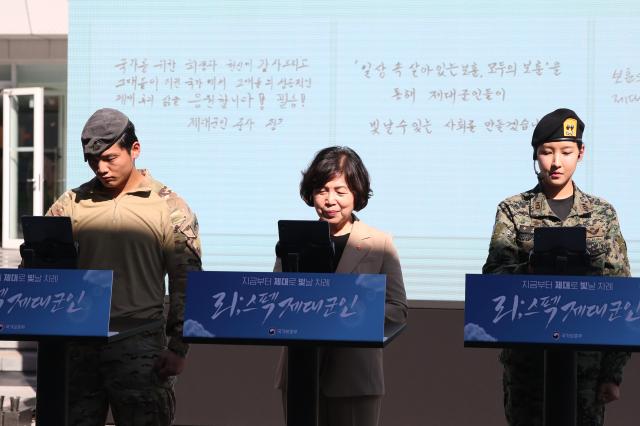 Minister of Patriots and Veterans Affairs Kang Jeong-aicenter writes a message of support for veterans at the Military veterans week event at COEX in Seoul on Oct 8 2024 AJP Han Jun-gu