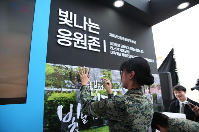 A veteran assembles a puzzle featuring messages of support at the Military veterans week event at COEX in Seoul on Oct 8 2024 AJP Han Jun-gu