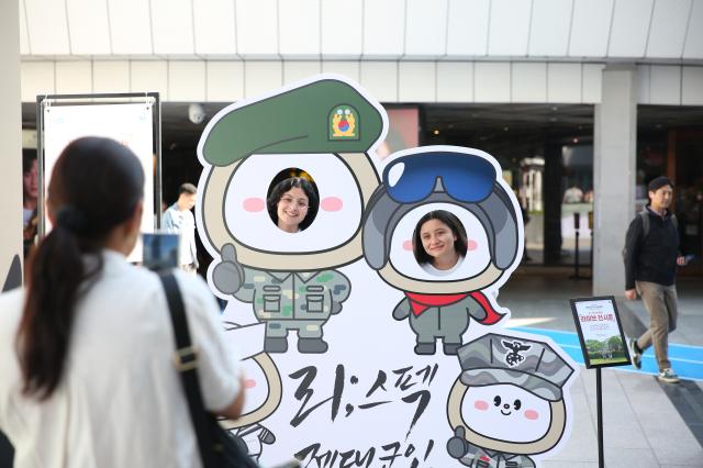 Visitors take photos at the Military veterans week event at COEX in Seoul on Oct 8 2024 AJP Han Jun-gu