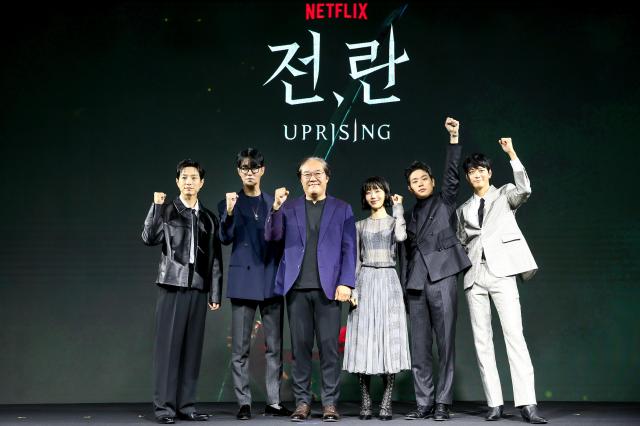 From left Actors Jung Sung-il Cha Seung-won director Kim Sang-man actors Kim Shin-rock Park Jeong-min and Gang Dong-won pose during a press conference for Uprising in Seoul on Oct 10 2024 AJP Kim Dong-woo