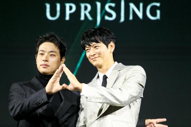 Actors Gang Dong-won right and Park Jeong-min pose during a press conference for Uprising in Seoul on Oct 10 2024 AJP Kim Dong-woo