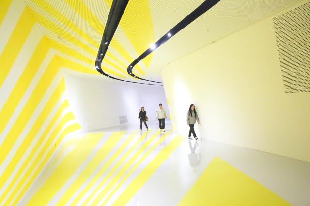 Visitors observe artwork at Felice Varinis “Colors Shapes Movements” exhibition held at DDP in Seoul on Oct 7 2024 AJP Han Jun-gu