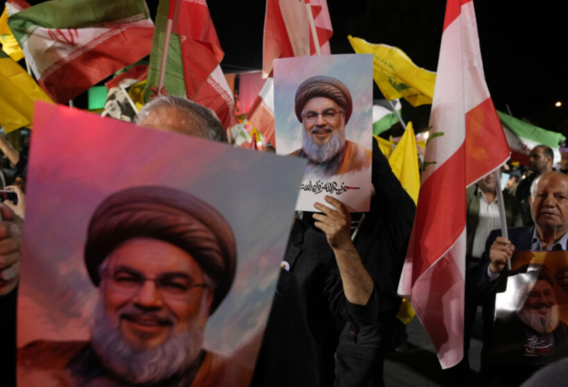 Iranian people demonstrate with a picture of Hezbollah leader Hassan Nasrallah in Palestine Square in Tehran Iran on Oct 1 2024 AP-Yonhap