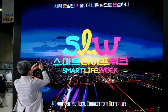 A visitor takes a photo at the Seoul Smart Life Week held at COEX in Seoul on Oct 11 2024 AJP Kim Dong-woo