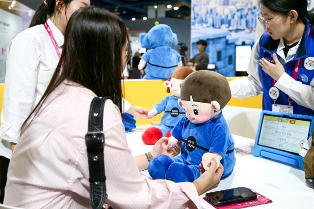 A visitor participates in a booth activity at the Seoul Smart Life Week held at COEX in Seoul on Oct 11 2024 AJP Kim Dong-woo