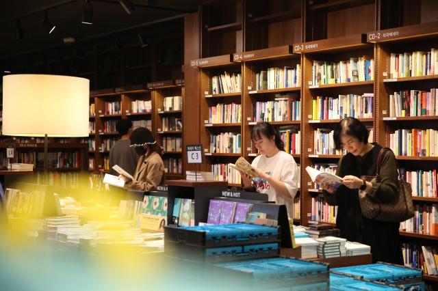 Visitors read books at Kyobo Bookstore in Seoul on Oct 12 2024 AJP Han Jun-gu