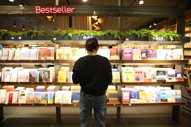 A visitor browses books at Kyobo Bookstore in Seoul on Oct 12 2024 AJP Han Jun-gu