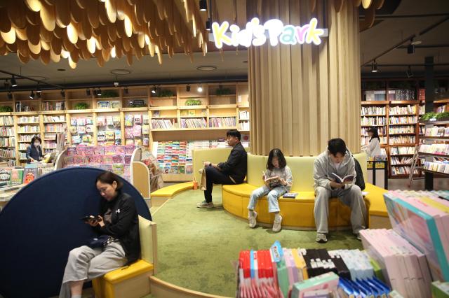 Visitors read books at Kyobo Bookstore in Seoul on Oct 12 2024 AJP Han Jun-gu