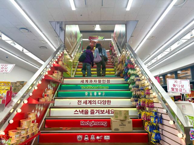 Visitors climb the stairs to the K-Ramyun Supermarket in Myeongdong Seoul on Oct 14 2024 AJP Han Jun-gu