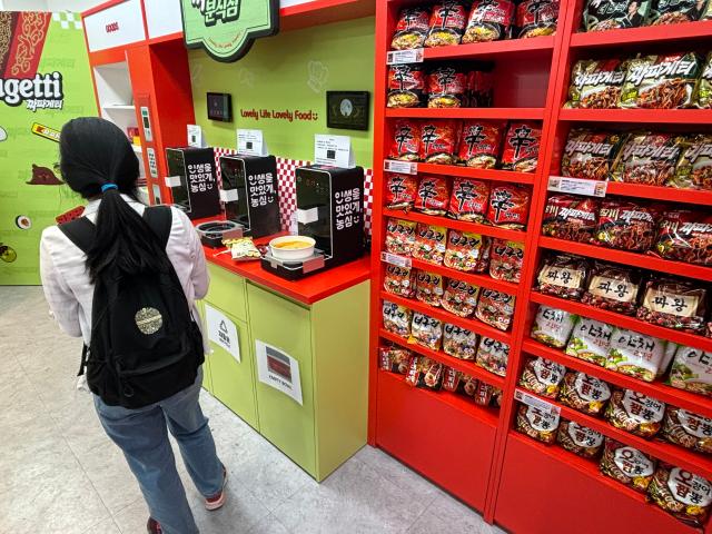 A visitor cooks ramyun using a ramyun cooker at the K-Ramyun Supermarket in Myeongdong Seoul on Oct 14 2024 AJP Han Jun-gu