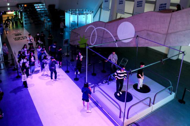 Visitors enjoy the Look Play Keep exhibition at Dongdaemun Design Plaza in Seoul on Oct 14 2024 AJP Kim Dong-woo