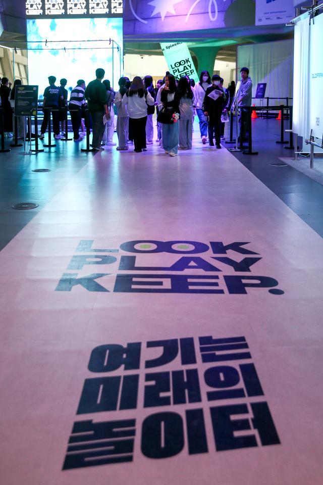 Visitors enjoy the Look Play Keep exhibition at Dongdaemun Design Plaza in Seoul on Oct 14 2024 AJP Kim Dong-woo