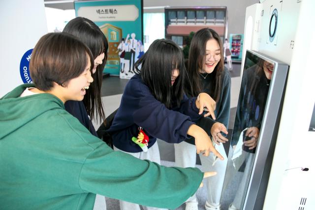 Visitors enjoy the Look Play Keep exhibition at Dongdaemun Design Plaza in Seoul on Oct 14 2024 AJP Kim Dong-woo