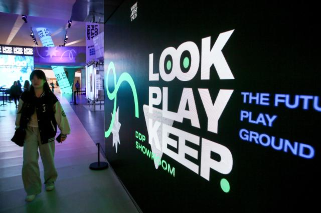 Visitors walk through the Look Play Keep exhibition at Dongdaemun Design Plaza in Seoul on Oct 14 2024 AJP Kim Dong-woo