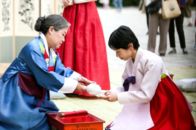 A student participates in a traditional coming-of-age ceremony at the National Folk Museum of Korea in Seoul on Oct 14 2024 AJP Kim Dong-woo