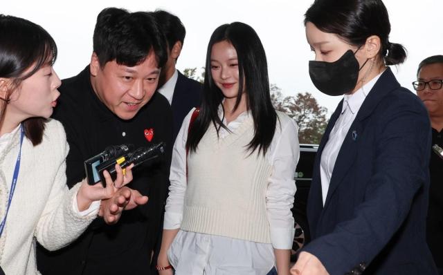 NewJeans member Hanni heads to the National Assembly’s Environment and Labor Committees audit hall in Yeouido Seoul on Oct15 2024 Yonhap