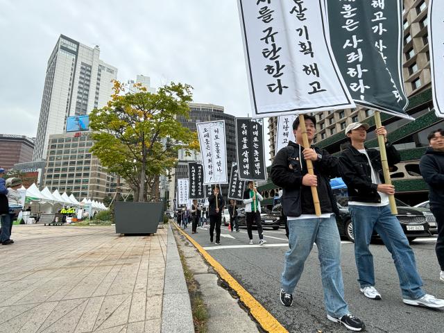 Seoul transit corporation labor union members march during a rally and memorial service demanding an apology for a deceased worker near Seoul city hall on Oct 15 2024 AJP Han Jun-gu