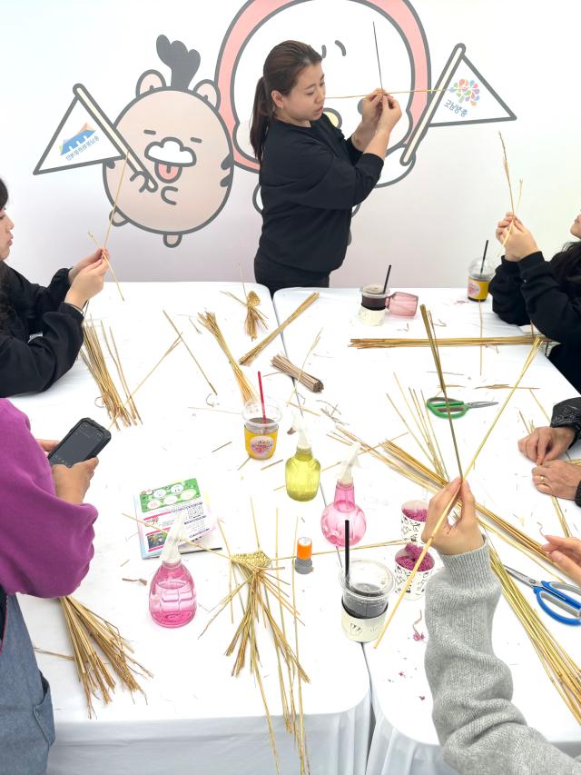 Visitors engage in traditional craft experiences at the Wow Festival in Gwanghwamun Plaza Seoul on Oct 15 2024 AJP Han Jun-gu
