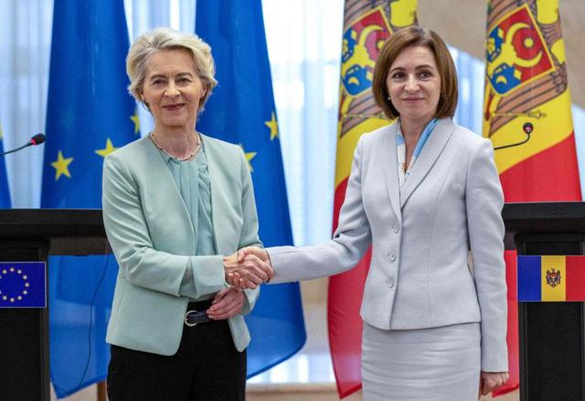 President of The European Commission Ursula von der Leyen left shakes hands with President of Moldova Maia Sandu during a press conference following bilateral meeting at the Moldovan Presidency headquarters in Chisinau on Oct 10 2024 AFP-Yonhap