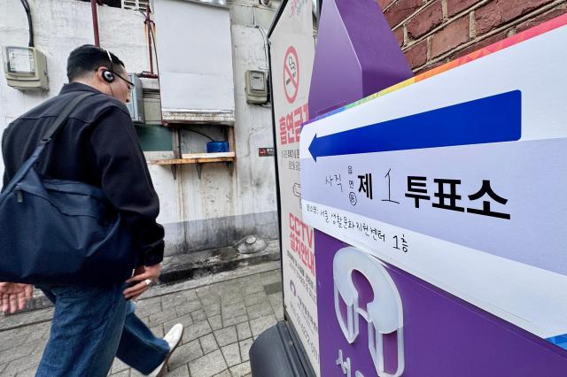 A voter walks into a polling station in Seoul on Oct 16 2024 AJP Kim Dong-woo