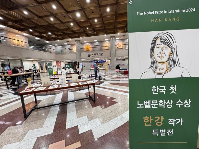 Visitors browse books at the special exhibition for author Han Kang at the National Assembly Library in Seoul on Oct 16 2024 AJP Kim Dong-woo