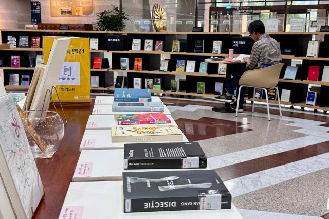 A visitor reads a book at the special exhibition for author Han Kang at the National Assembly Library in Seoul on Oct 16 2024 AJP Kim Dong-woo