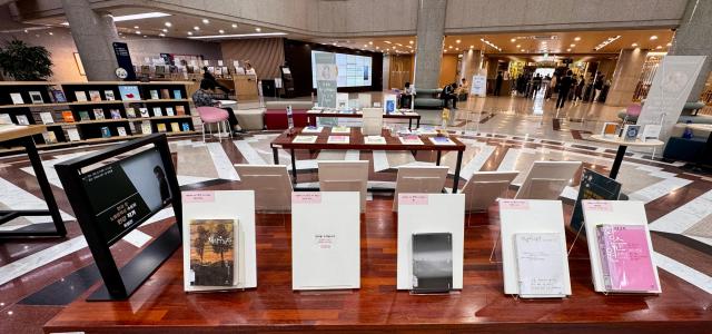 Visitors browse books at the special exhibition for author Han Kang at the National Assembly Library in Seoul on Oct 16 2024 AJP Kim Dong-woo