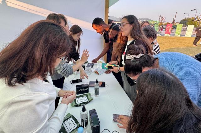 Visitors participate in booth activities at the Jongno Youth Startup Festival at Gwanghwamun Square in Seoul on Oct 16 2024 AJP Kim Dong-woo