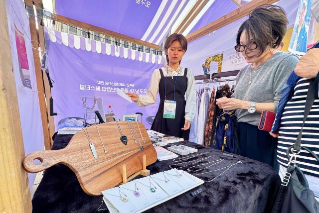 Visitors participate in booth activities at the Jongno Youth Startup Festival at Gwanghwamun Square in Seoul on Oct 16 2024 AJP Kim Dong-woo