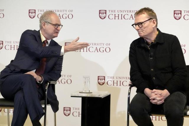 University of Chicago professor James A Robinson right one of three winners of the 2024 Nobel Prize in Economics listens to a question from university president Paul Alivisatos during a news conference honoring Robinson in Chicago on Oct 14 2024 AP-Yonhap