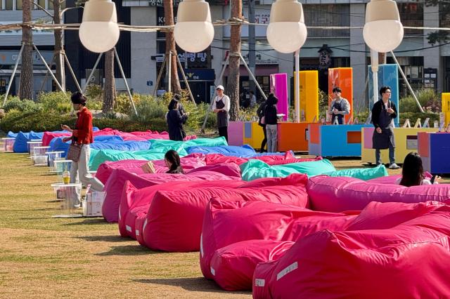 Visitors read books at the Seoul Outdoor Library in Seoul City Hall Plaza on Oct 17 2024 AJP Kim Dong-woo