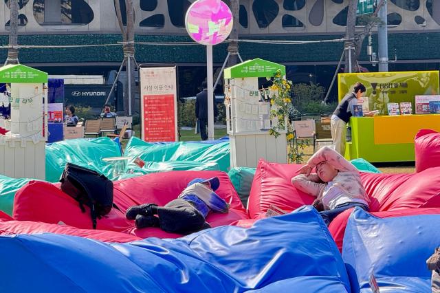 Visitors relax at the Seoul Outdoor Library in Seoul City Hall Plaza on Oct 17 2024 AJP Kim Dong-woo