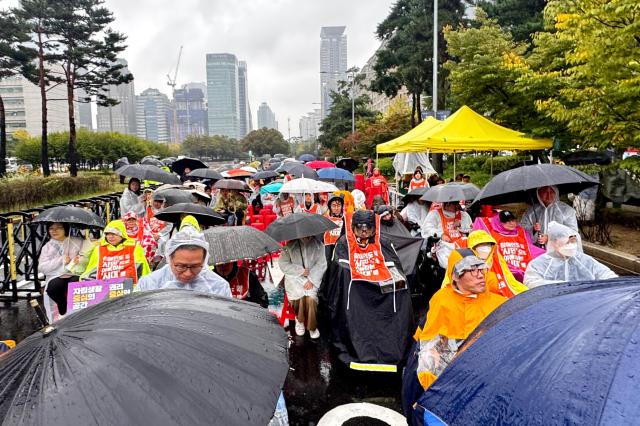 Members of the Korea Council of Centers for Independent Living rally in front of the National Assembly in Seoul on Oct 18 2024 calling for the enactment of the Independent Living Rights Guarantee Bill for people with disabilities by the end of the year AJP Kim Dong-woo