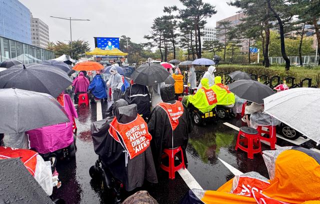 Members of the Korea Council of Centers for Independent Living rally in front of the National Assembly in Seoul on Oct 18 2024 calling for the enactment of the Independent Living Rights Guarantee Bill for people with disabilities by the end of the year AJP Kim Dong-woo