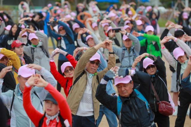 Participants warm up before the start of the Walking Festival for the Blue House and Five Royal Palaces in Seoul on Oct 19 2024 AJP NG