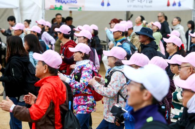 Participants warm up before the start of the Walking Festival for the Blue House and Five Royal Palaces in Seoul on Oct 19 2024 AJP Kim Dong-woo