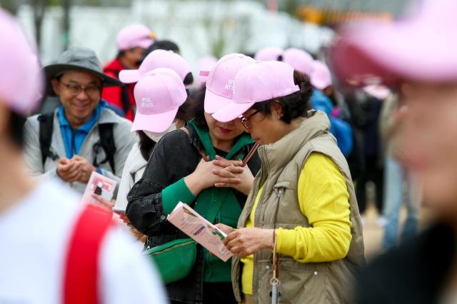 Participants wait before the start of the Walking Festival for the Blue House and Five Royal Palaces in Seoul on Oct 19 2024 AJP Kim Dong-woo