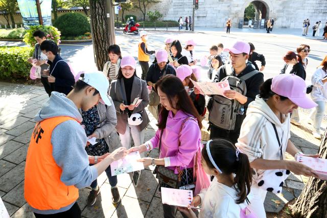 Participants collect stamp marks at the Walking Festival for the Blue House and Five Royal Palaces in Seoul on Oct 19 2024 AJP Kim Dong-woo