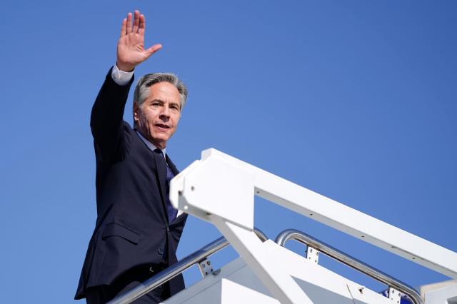 US Secretary of State Antony Blinken waves while boarding a plane headed to the Middle East departing from Joint Base Andrews Maryland US on Oct 21 2024