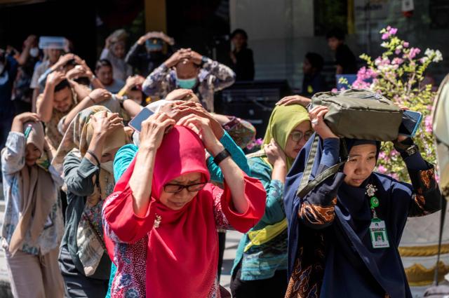 People take part in an earthquake drill in Surabaya on Oct10 2024 AFP-Yonhap