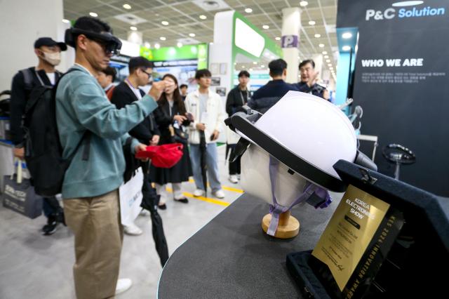 A visitor tries out a device at the KES 2024 at COEX in Seoul on Oct 22 2024 AJP Kim Dong-woo