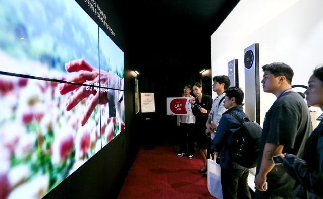 Visitors look at exhibition booths at KES 2024 at COEX in Seoul on Oct 22 2024 AJP Kim Dong-woo