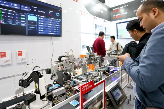 Visitors look at exhibition booths at KES 2024 at COEX in Seoul on Oct 22 2024 AJP Kim Dong-woo