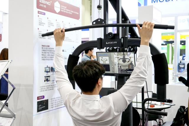 A visitor tries out a device at the KES 2024 at COEX in Seoul on Oct 22 2024 AJP Kim Dong-woo