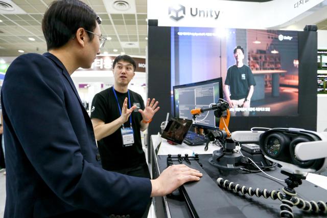 A visitor consults with an exhibitor at the KES 2024 at COEX in Seoul on Oct 22 2024 AJP Kim Dong-woo