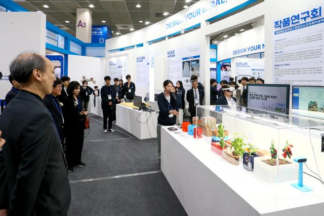 Visitors look at exhibition booths at KES 2024 at COEX in Seoul on Oct 22 2024 AJP Kim Dong-woo