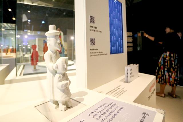 Members of the press view exhibits at the Parade special exhibition press conference at the National Folk Museum of Korea in Seoul on Oct 22 2024 AJP Kim Dong-woo