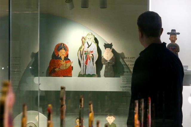 A visitor views exhibits at the Parade special exhibition at the National Folk Museum of Korea in Seoul on Oct 22 2024 AJP Kim Dong-woo