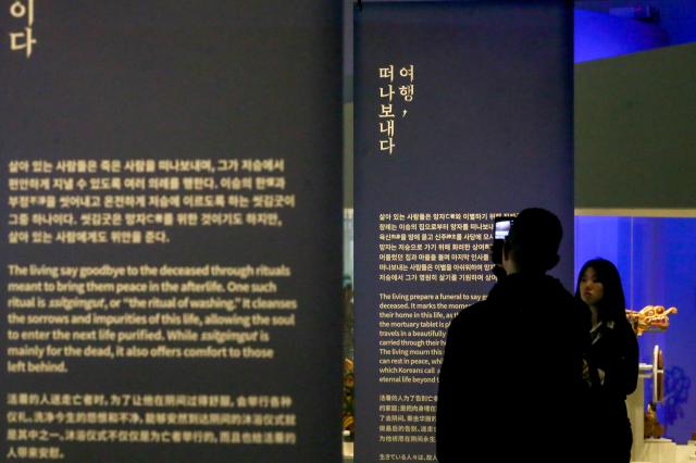 A visitor takes a photo at the Parade special exhibition at the National Folk Museum of Korea in Seoul on Oct 22 2024 AJP Kim Dong-woo