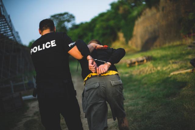 This photo shows a man being arrested by the police Getty Images Bank